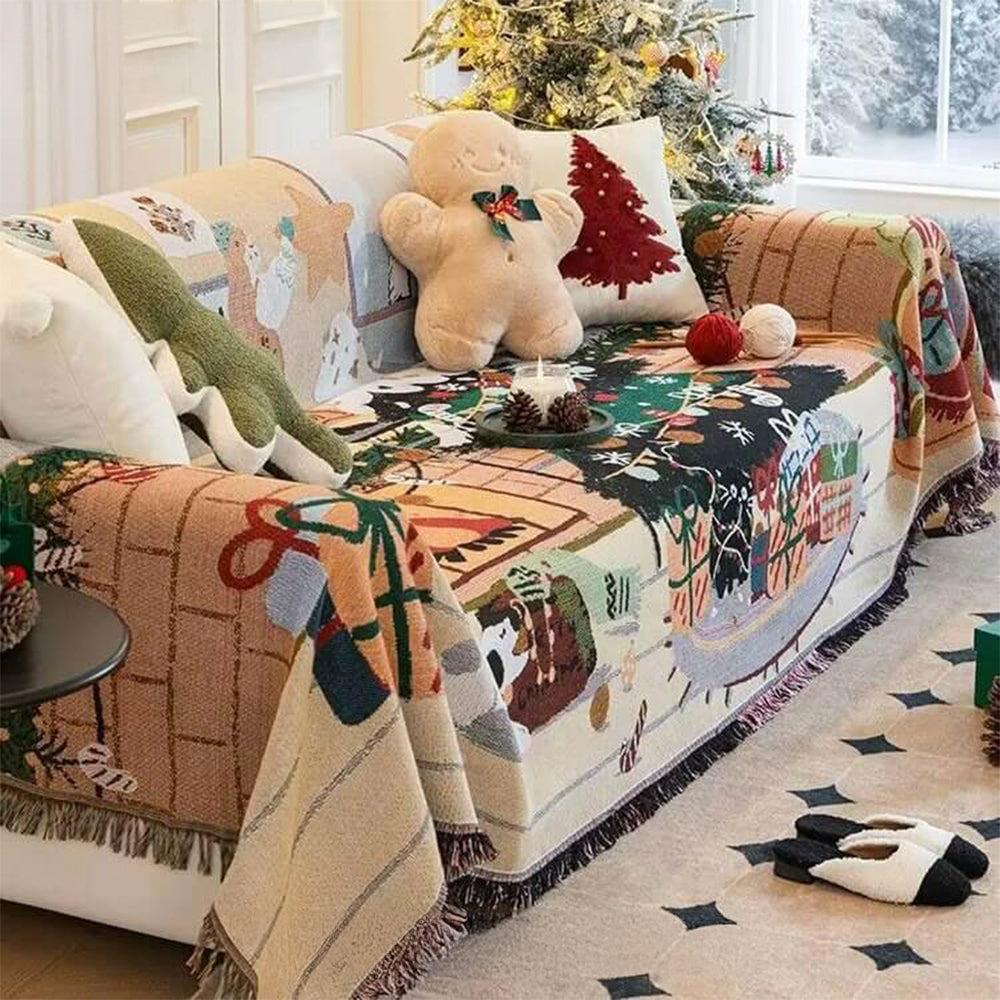 Cozy Christmas couch cover featuring Santa and reindeer designs.