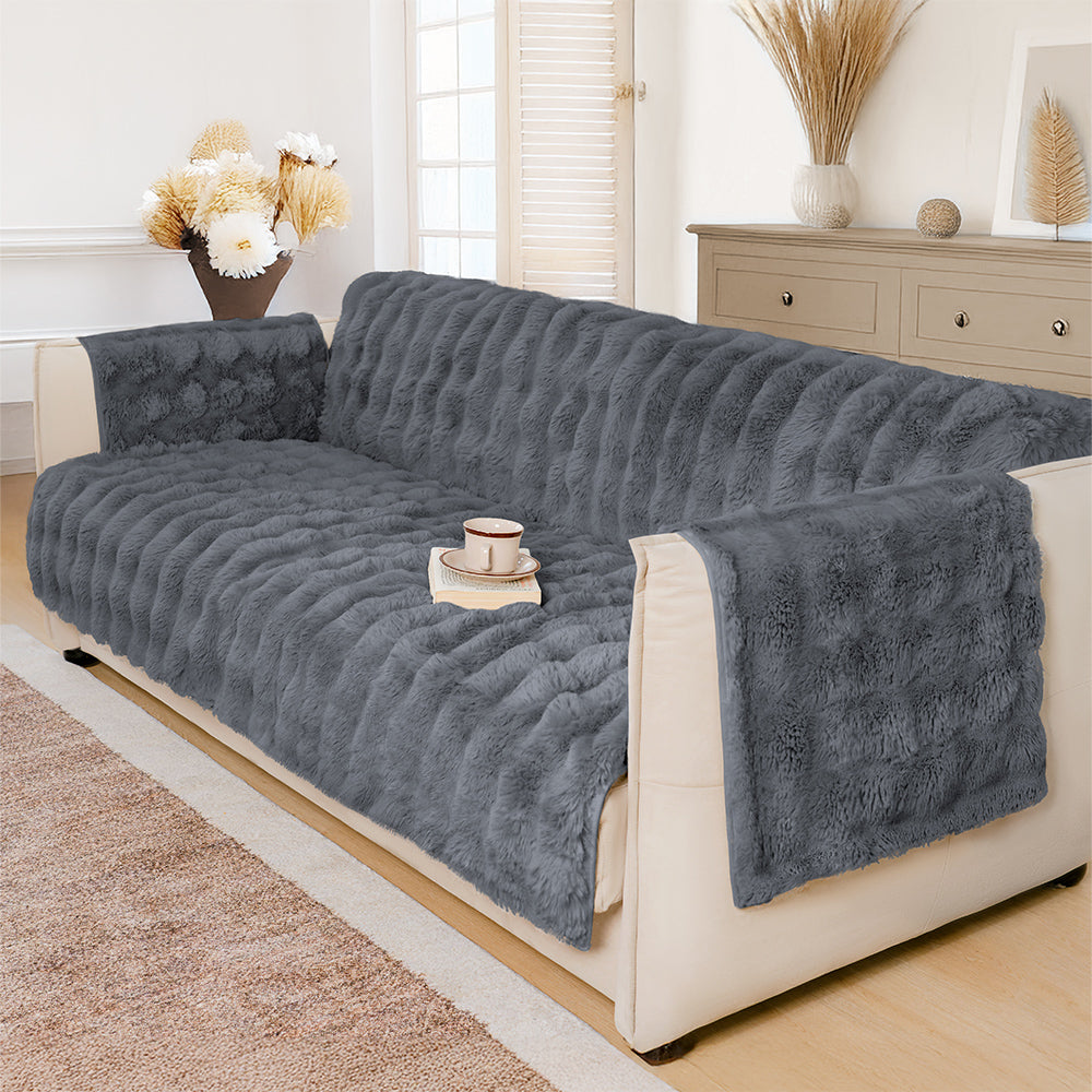 EverDry fluffy sofa cover draped over a modern gray couch