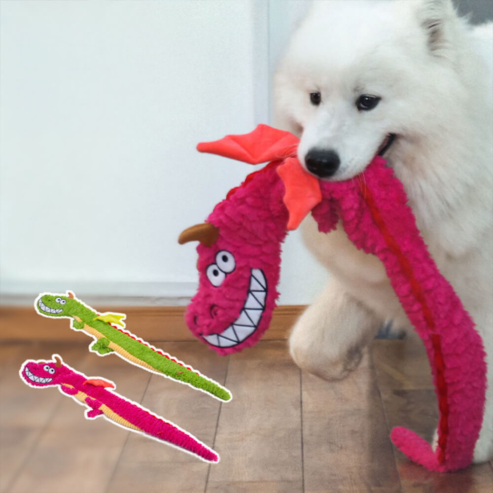 Close-up of the plush crinkle dragon toy showing embroidered details and squeaker