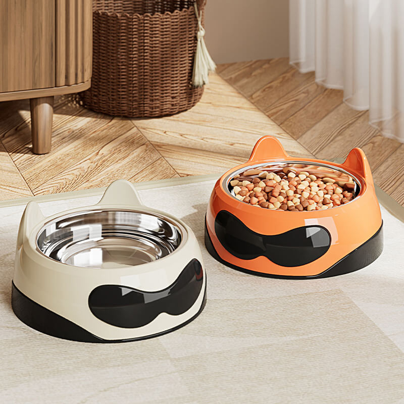 Stainless steel pet bowl with non-slip base, filled with kibble