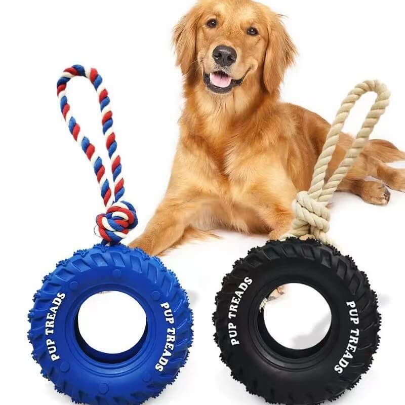 ToughTire Interactive Dog Toy being chewed by a large breed dog