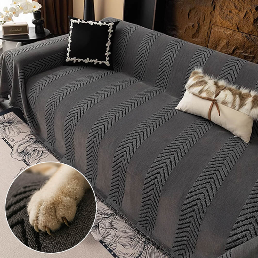 Overhead view of a beautifully draped CozyGuard Herringbone Chenille sofa protector on a grey sofa, showcasing its elegant herringbone pattern.