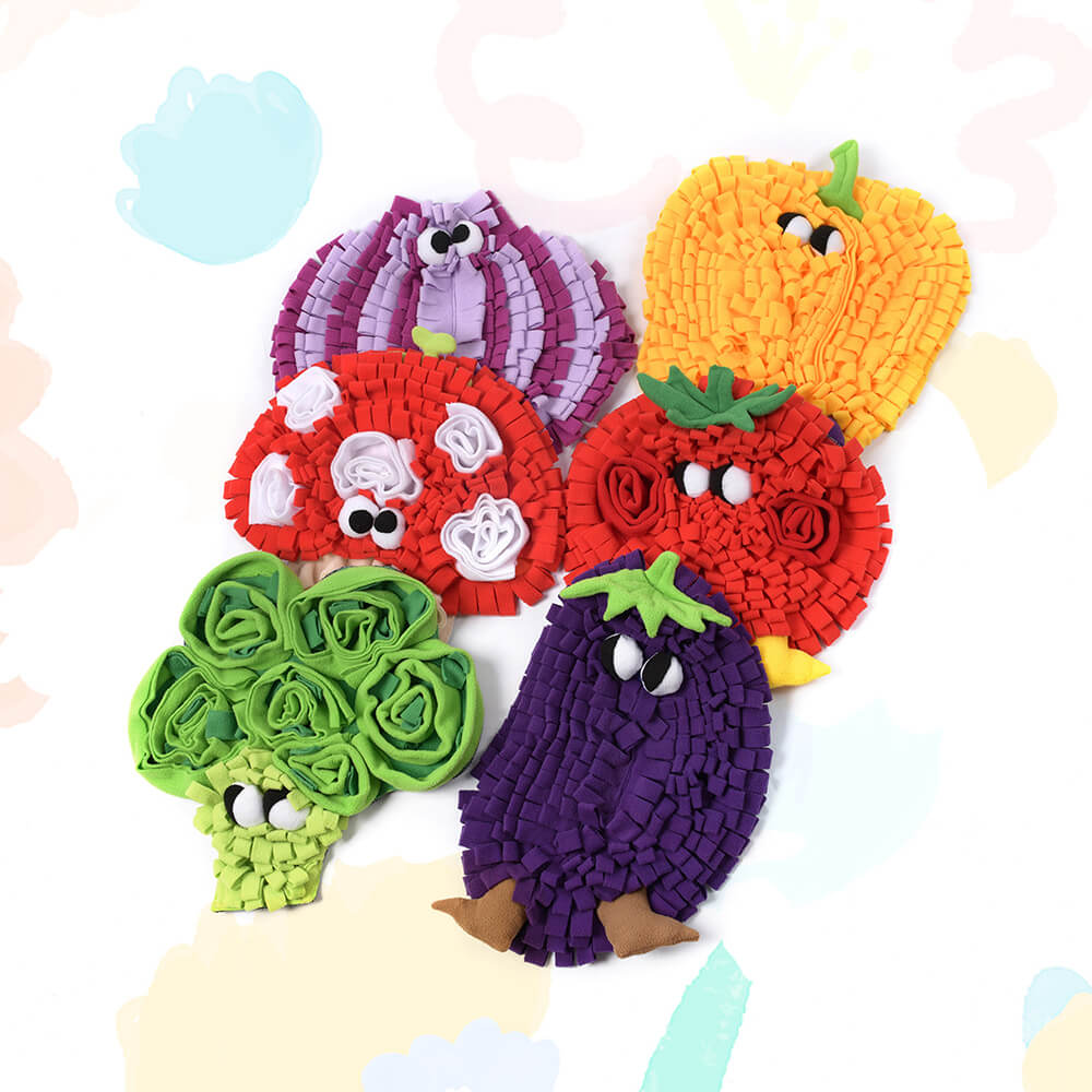Close-up of the veggie-shaped snuffle mat showing textures and colors.