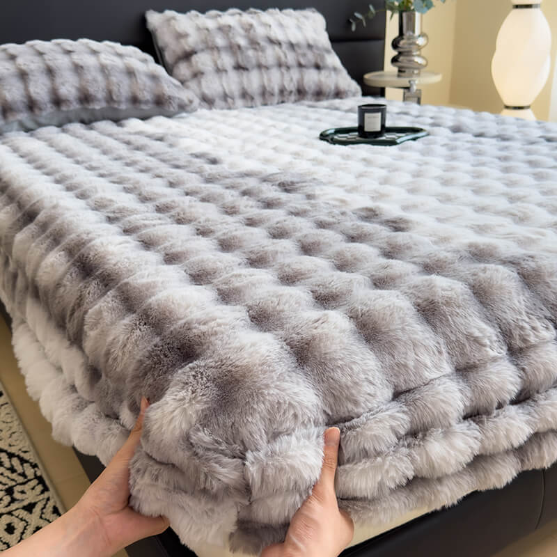 Close-up of the soft texture of the luxury faux rabbit plush fitted sheet.