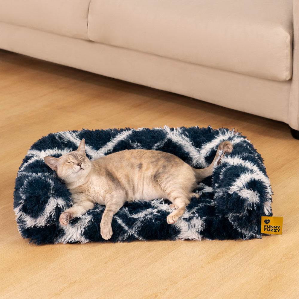 Cozy plaid orthopedic cat sofa bed with faux fur lining for warmth - perfect for cold winter days.