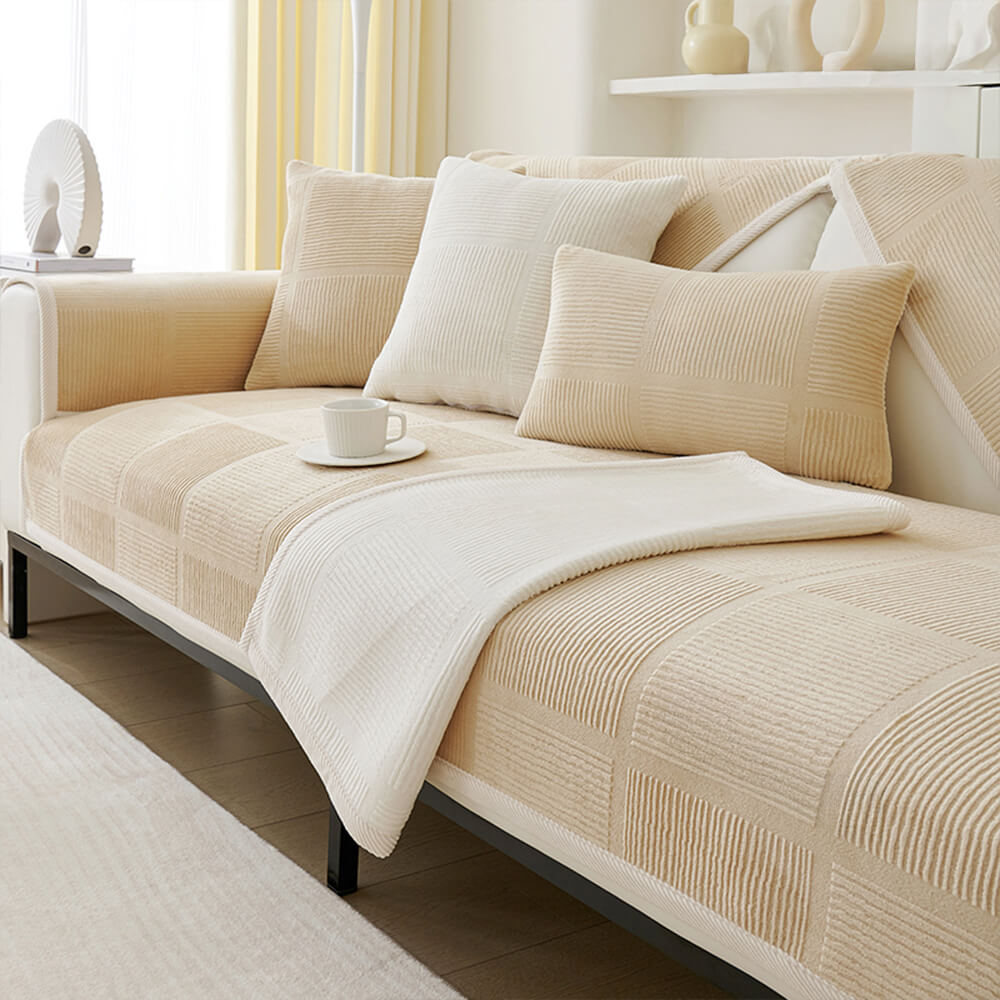 Elegant striped sofa slipcover draped over a couch, showcasing its plush texture.