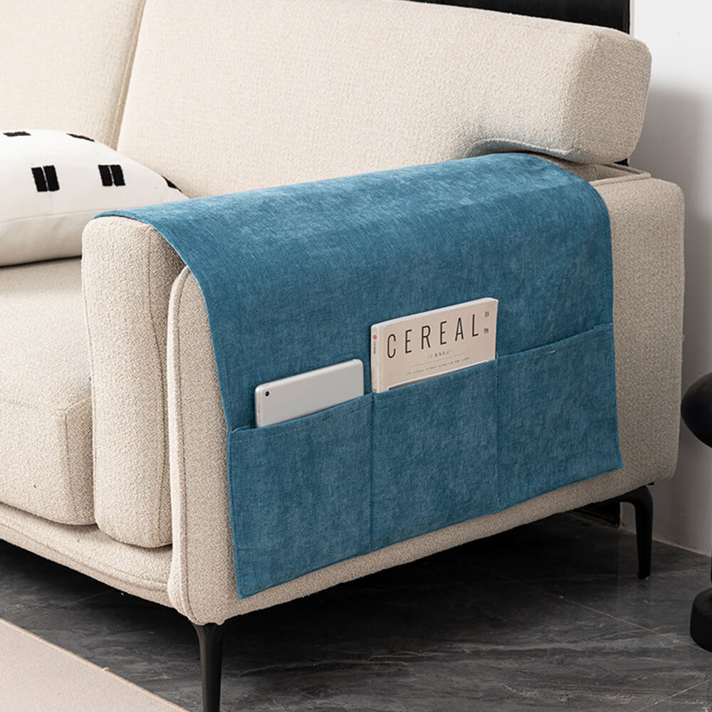 Close-up of chenille armrest cover on a gray couch, showcasing soft texture and snug fit.