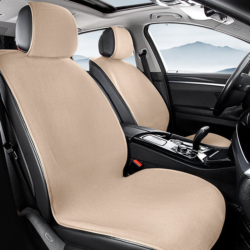 A pet seated comfortably on a breathable chenille car seat cover during a road trip