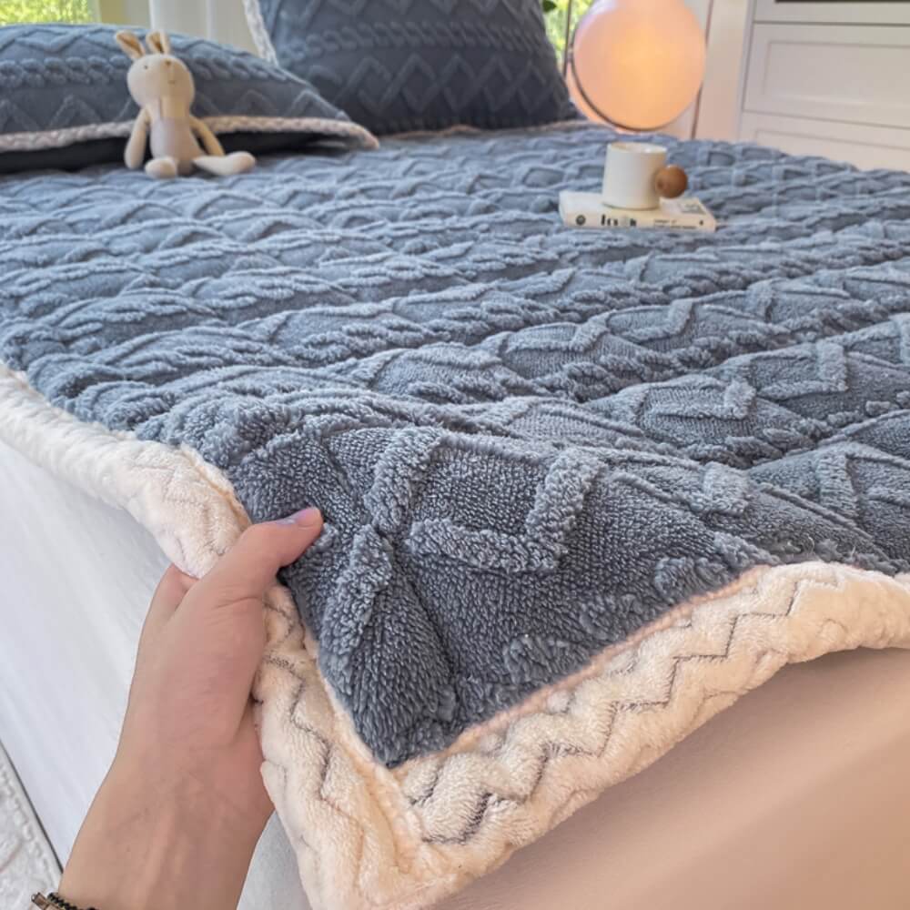 Close-up of Luxura plush mattress topper showing twisted jacquard pattern and thick cushioning