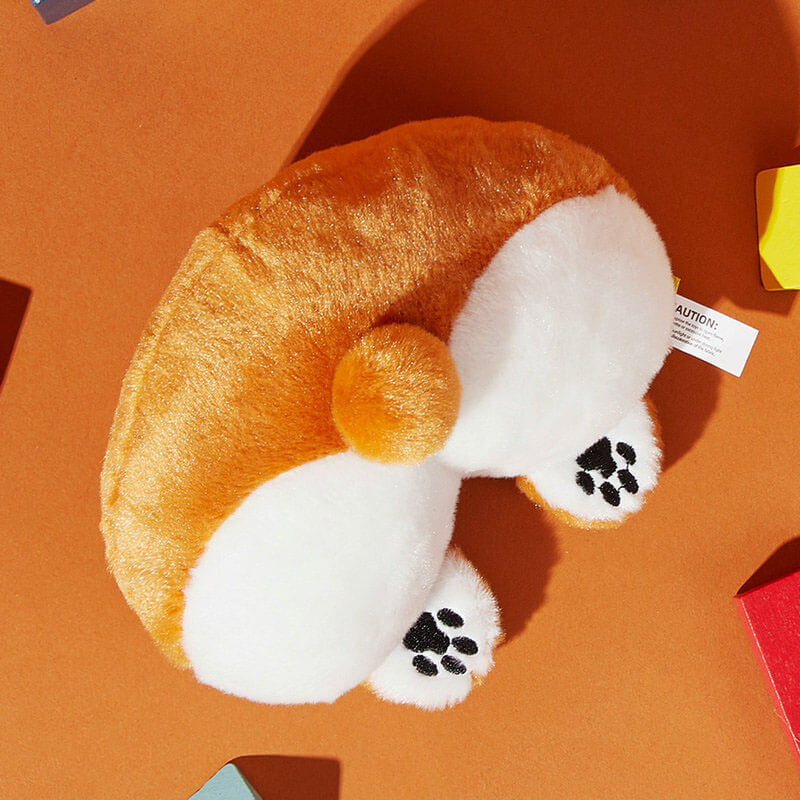 Squeaky Butt Buddy plush dog toy being squeezed by a dog, making a squeaky sound