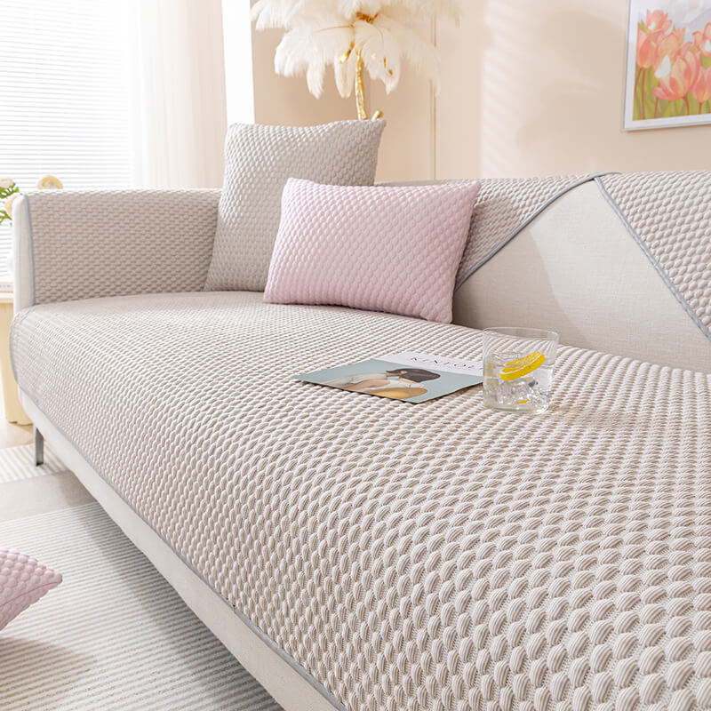 A neatly fitted EverGuard cooling sofa cover in a living room setting, showcasing its smooth texture and protective qualities.