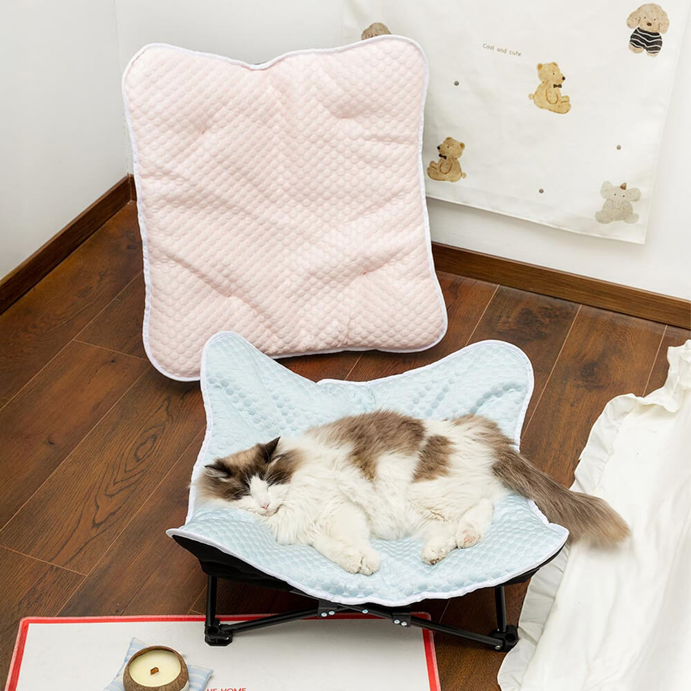 Chill & Relax portable elevated dog bed with cooling fabric in outdoor setting.