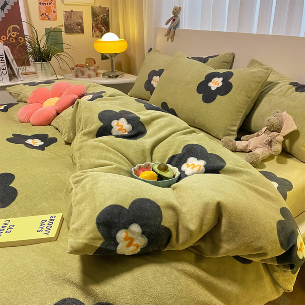 Close-up of floral print velvet bed sheets with pillowcases, showing detailed embroidery and vibrant colors