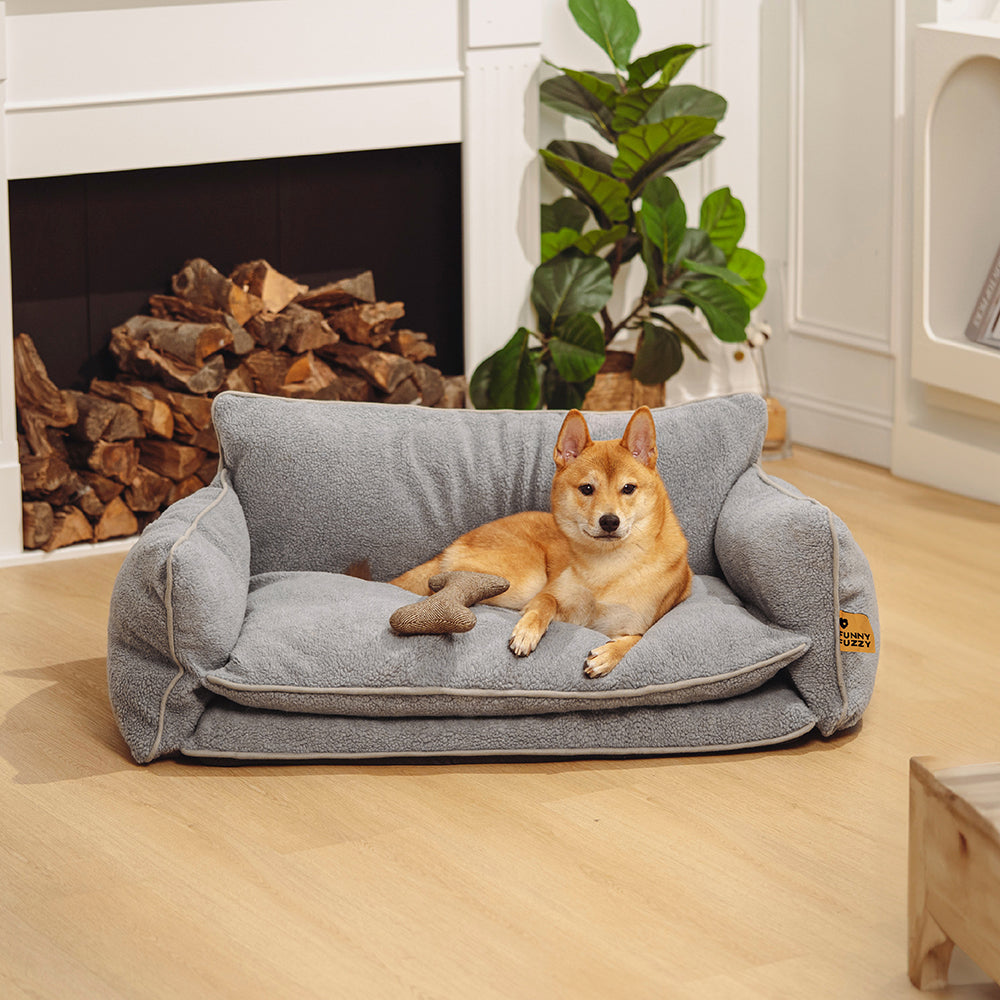 Cozy double layer faux lambswool pet sofa bed from the side, showcasing its plush design.