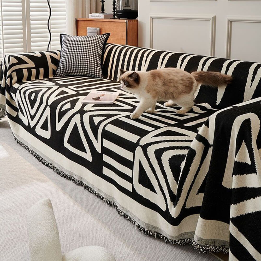 Close-up of vibrant geometric sofa cover showcasing its durable fabric and bold patterns.