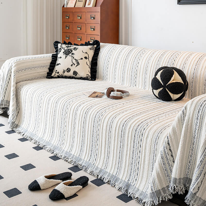 Jacquard chenille sofa cover protecting a couch from pet scratches