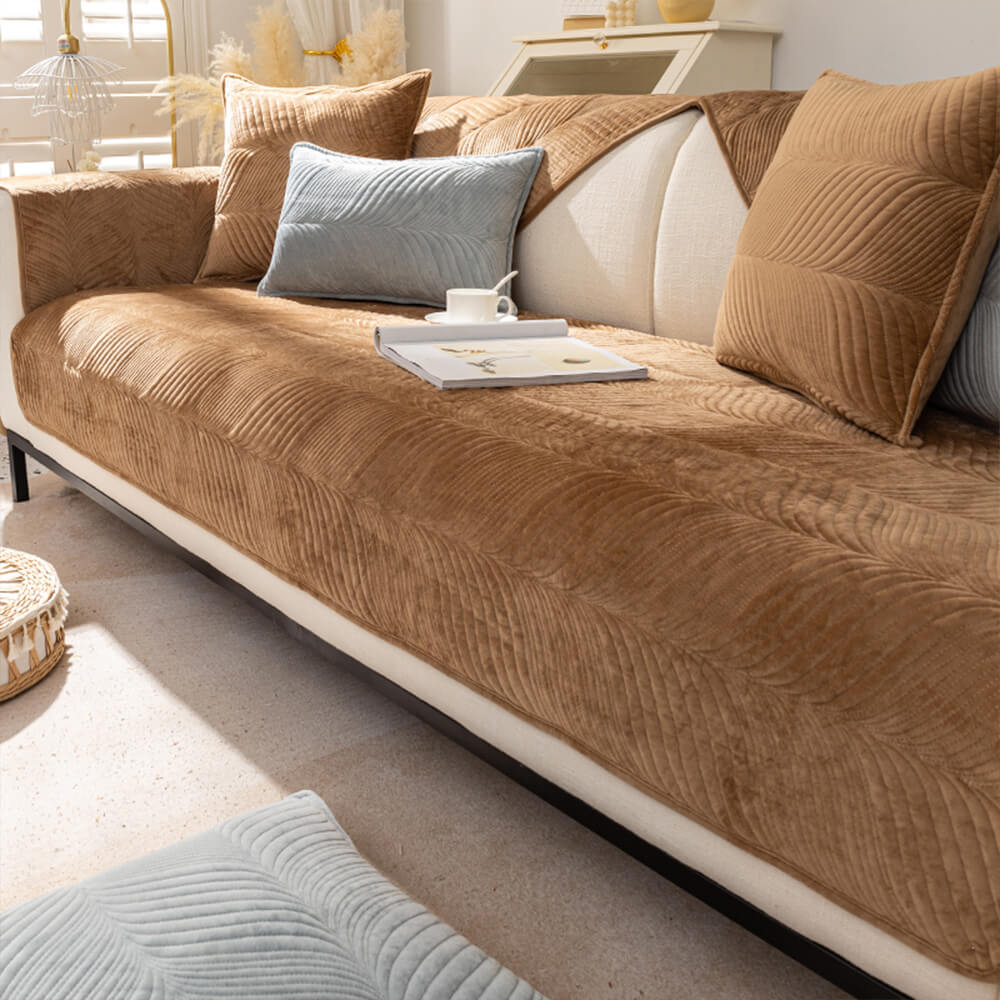 Stylish leaf pattern plush couch cover on a modern sofa, perfect for winter warmth