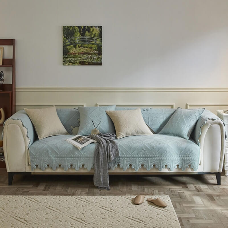 Leaf-trim cotton sofa cover draped elegantly over a modern couch