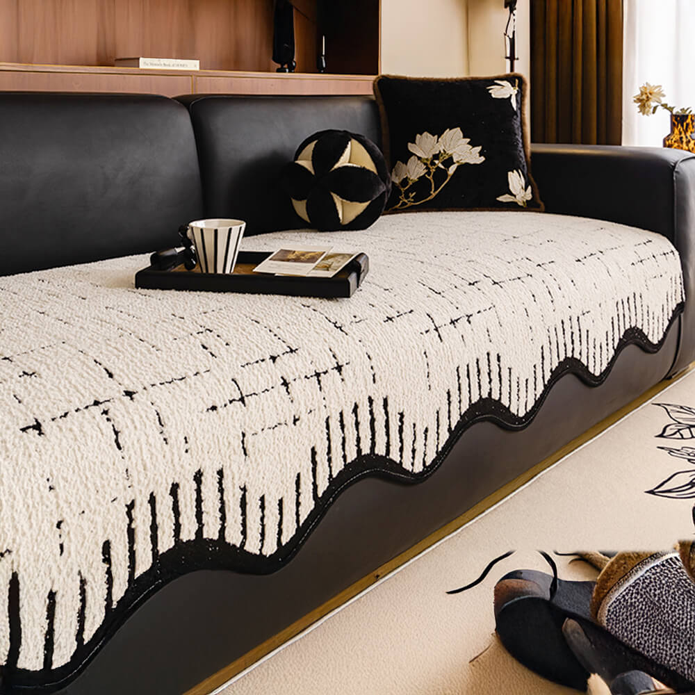 Front angle of plush couch cover showing thick fabric and wave-edge design.