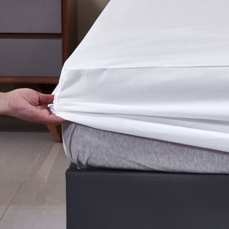 Top-down view of the EverPure waterproof fitted sheet set on a queen mattress with neutral color bedding.