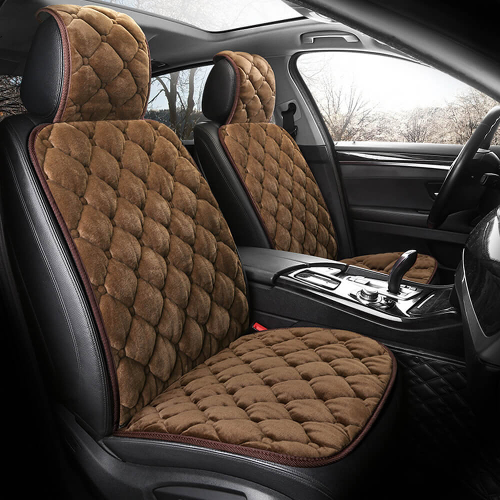 Close-up of plush fabric on a winter car seat cushion showing soft texture
