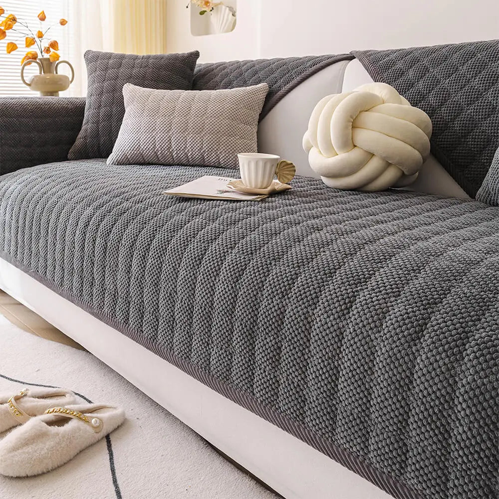 Close-up of quilted corduroy texture on anti-slip couch cover, showcasing plush detailing.