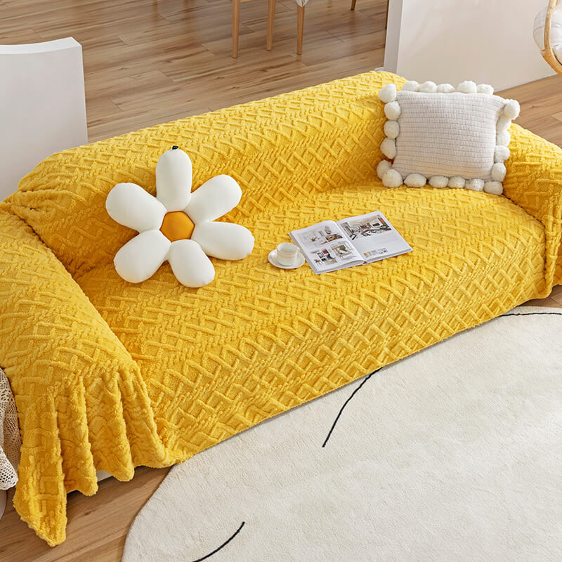 Front angle of CozyGuard™ fleece couch cover on a 3-seater sofa with embossed design