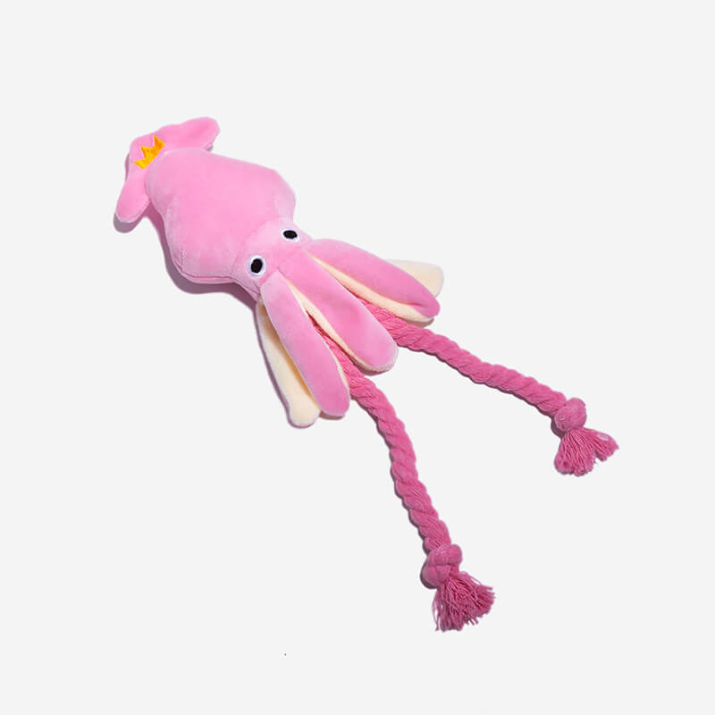 Pink squid plush dog toy with squeaker and cord for teeth care, front view