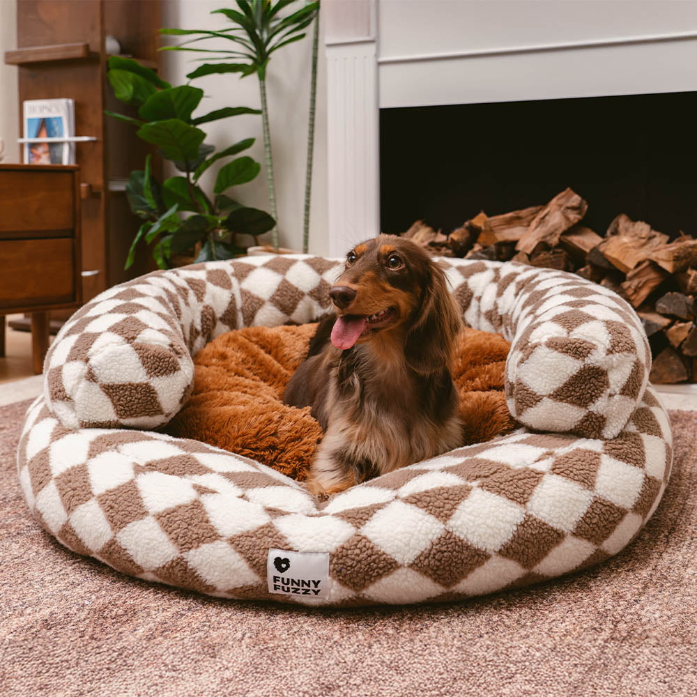 Stylish Argyle dog bed with plush bolsters and cozy fabric, perfect for lounging.