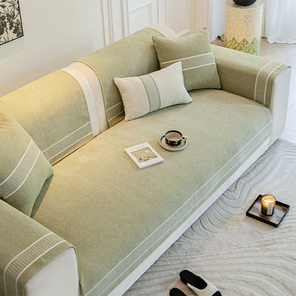 Luxury Chenille Sofa Cover with wide edge design on a leather sofa
