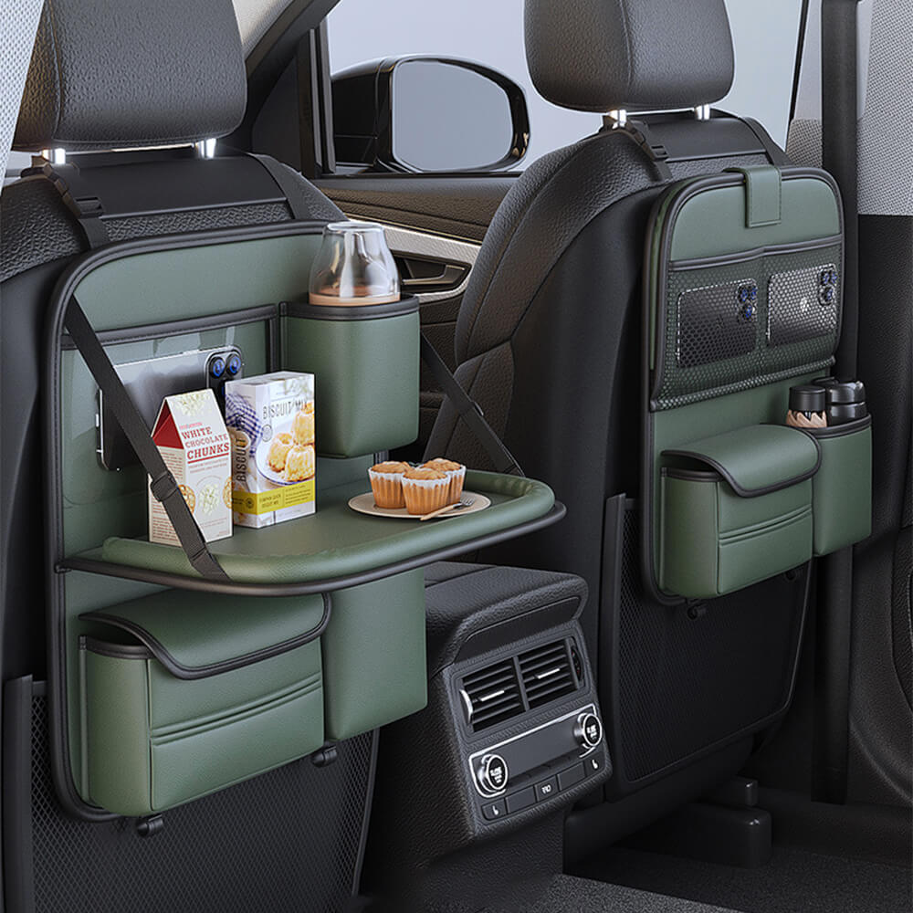 Backseat organizer with tray table in an SUV, showcasing storage pockets.