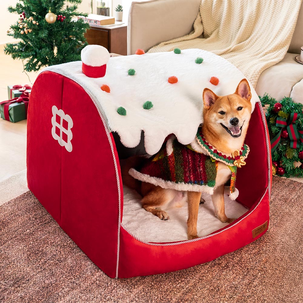Close-up of Christmas dog bed with snow cottage design and plush interior