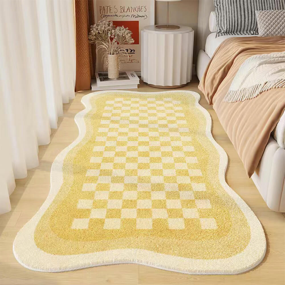 Cozy faux cashmere checkerboard rug placed beside a bed, showcasing its soft texture.