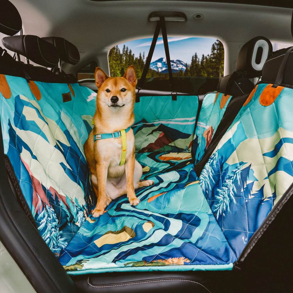 Full back seat view of TropiPalm dog car seat cover with palm pattern and mesh window