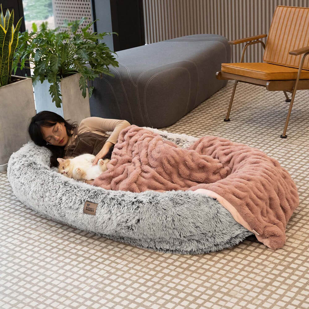 Close-up of the waterproof human dog bed showing premium stitching and plush texture
