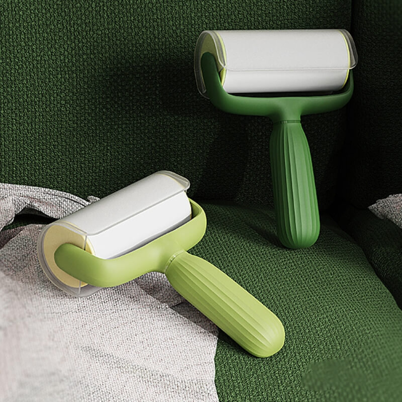 Close-up of MagicPet sticky roller removing golden retriever hair from a sofa