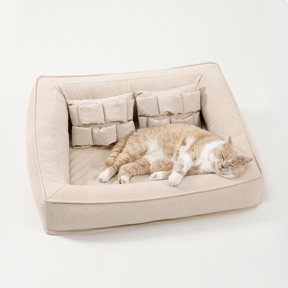 Orthopedic dog sofa bed with pillows showing plush support and anti-slip bottom