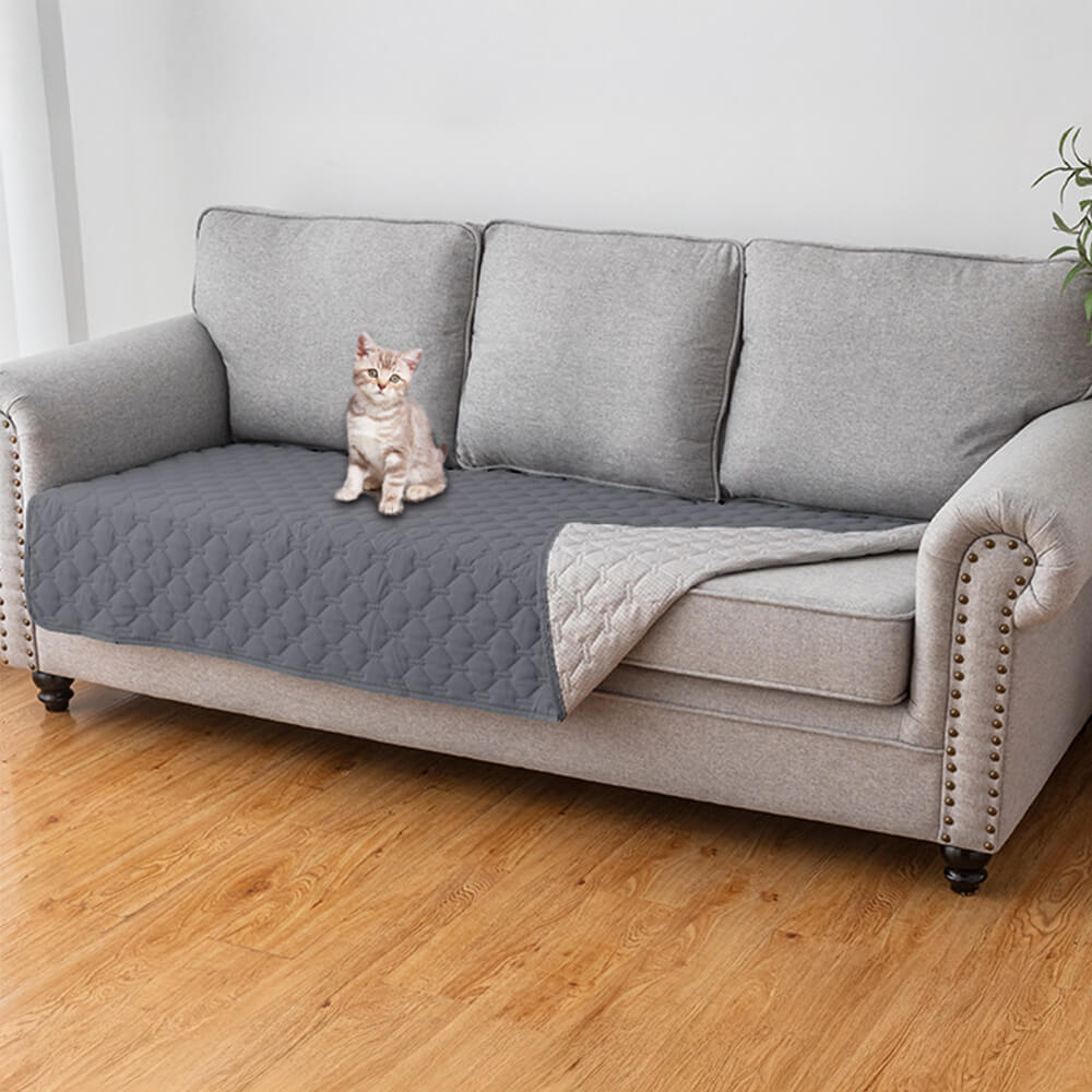 Stylish waterproof couch cover on a modern sofa, showcasing its diamond quilted design.