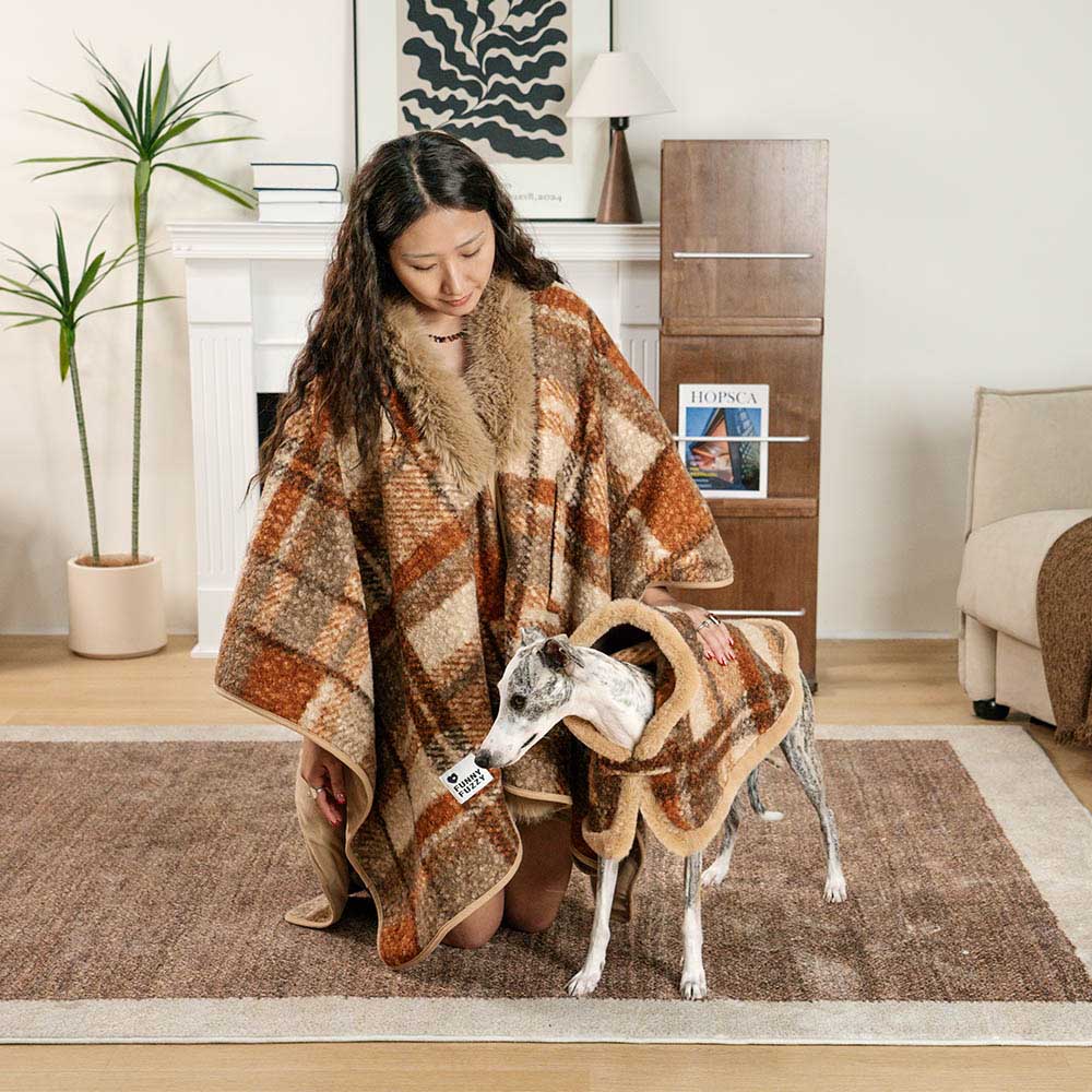 Twin Peaks Plaid Poncho Set - human and dog wearing matching ponchos on a winter stroll