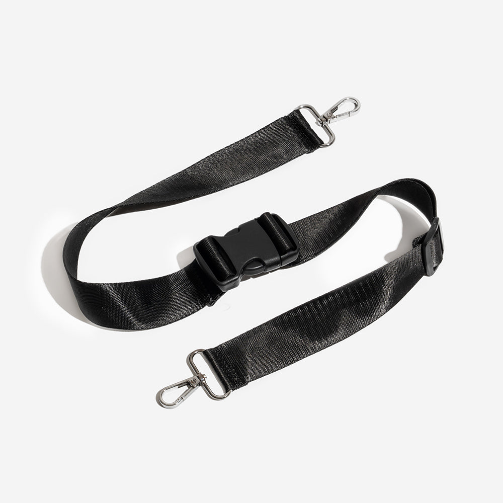 Close-up of an adjustable dog car seat strap with heavy-duty metal buckles, showing material quality for dog car safety.