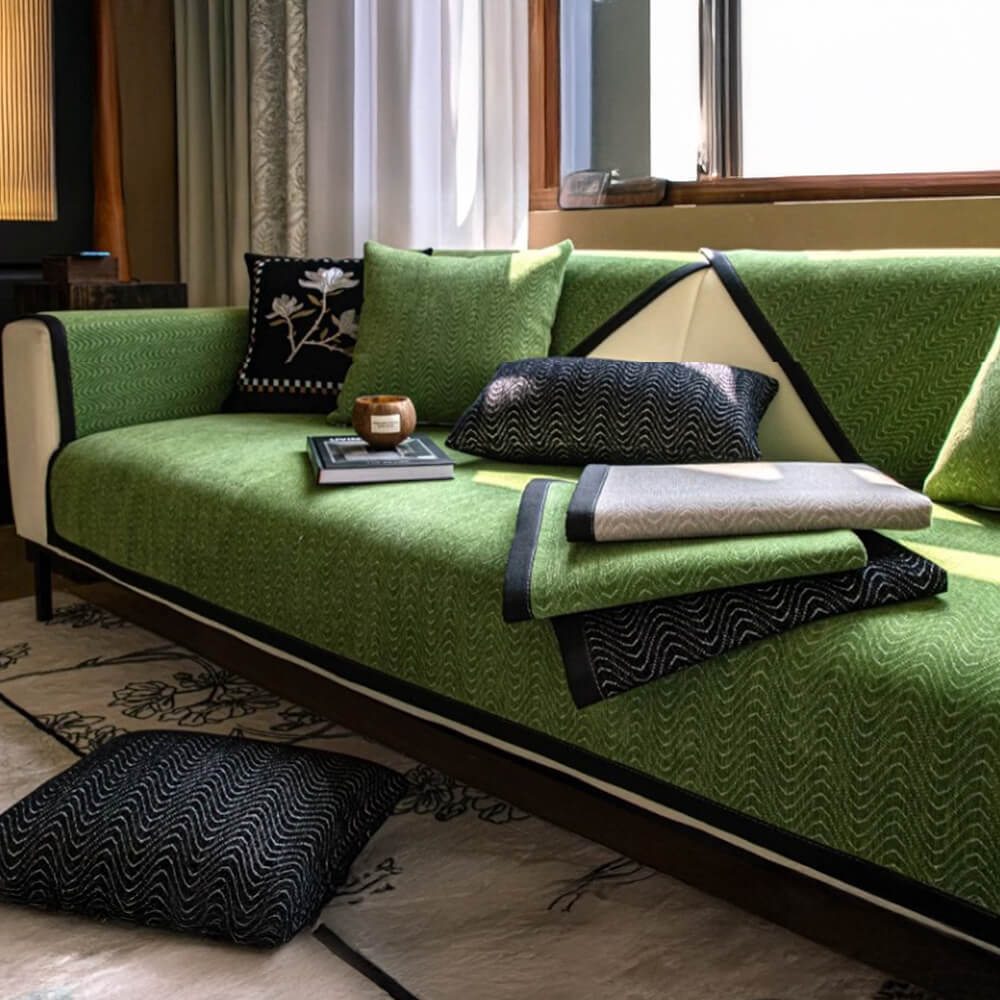 Top view of the wavy chenille couch cover in olive green, fitted perfectly across a modern sofa.
