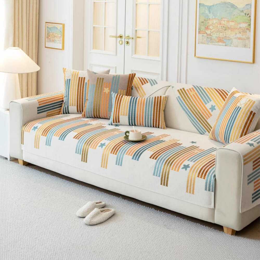 Chenille couch cover on a living room sofa, protecting it from pet scratches