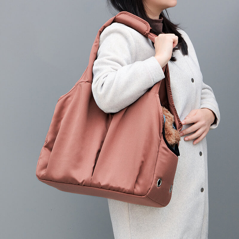 Soft Sling Pet Carrier with Safety Rope being used for travel
