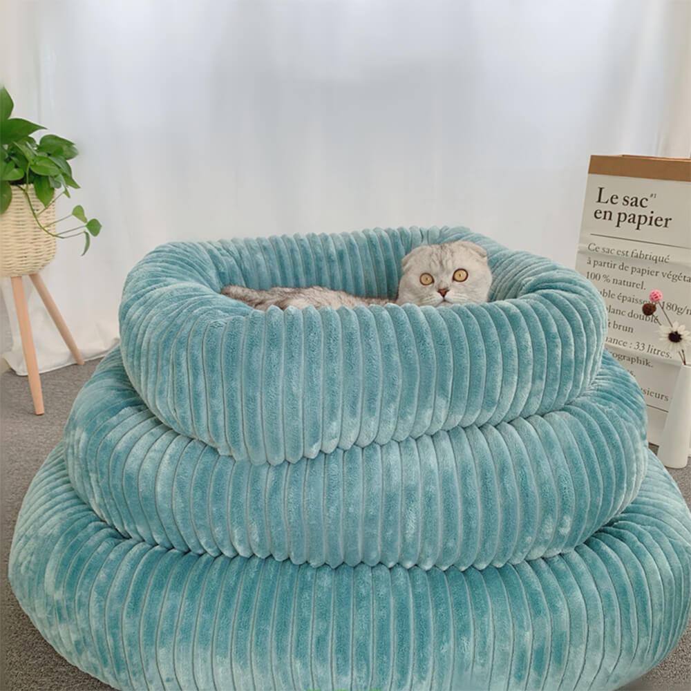 Grey fluffy pet bed with a golden retriever curled up inside, showcasing its cozy winter-ready design