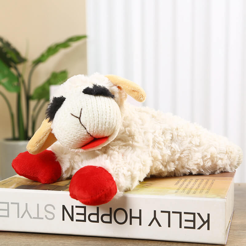 Plush squeaky sheep toy for dogs with vibrant red feet and cheerful face, ideal for interactive play
