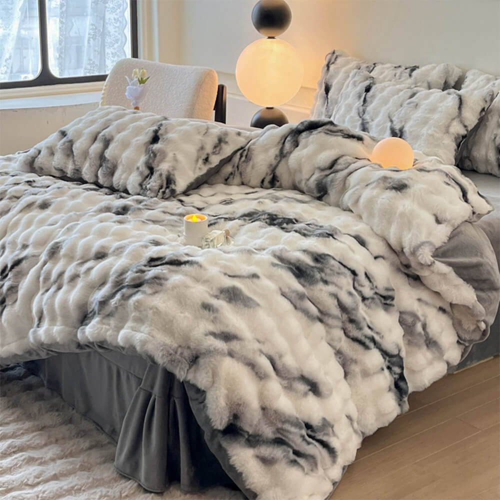 Angled view of the CloudSoft faux rabbit fur duvet cover draped over bed, showcasing its thick warmth