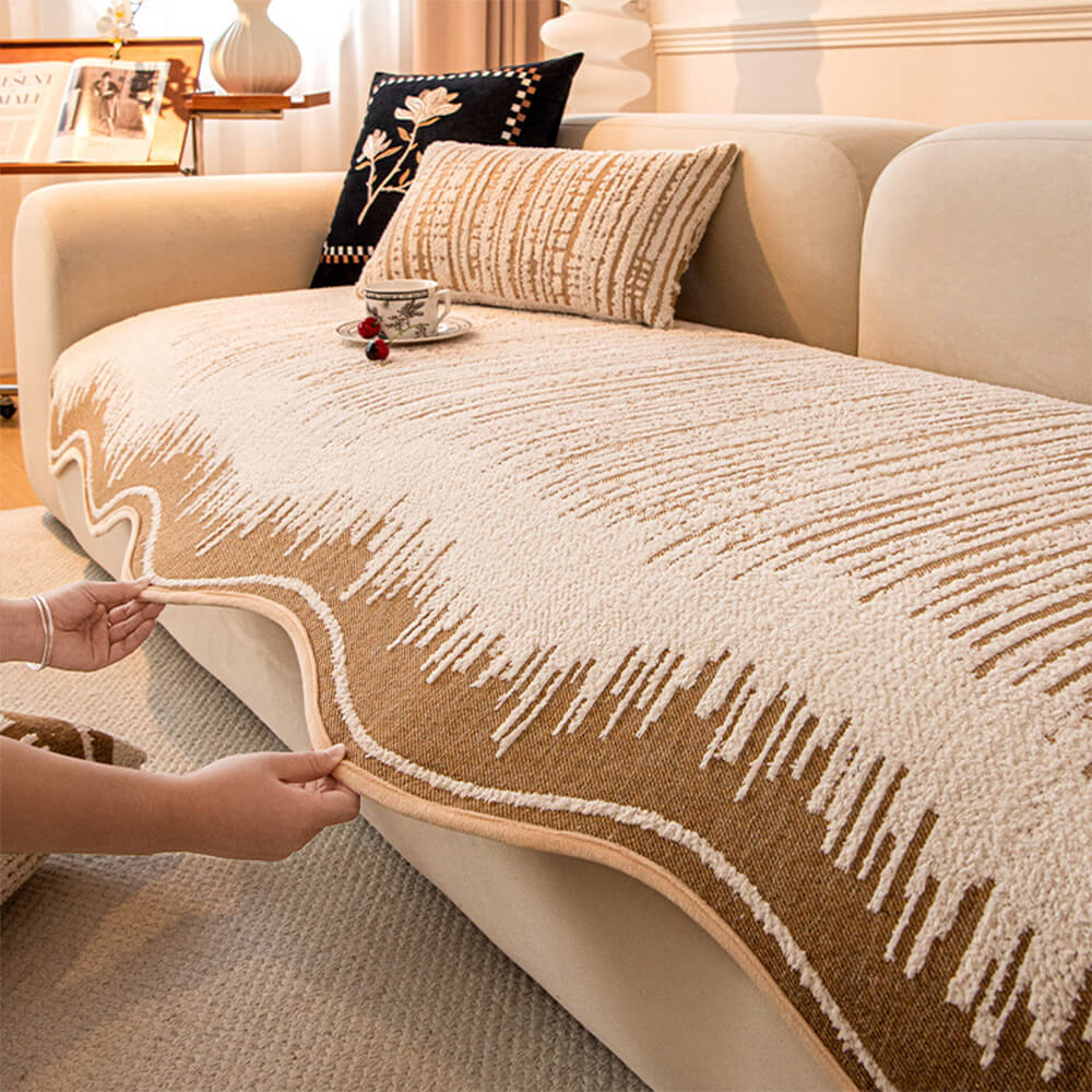 Overhead angle of plush sofa cover showcasing modern abstract pattern and wavy edge finish