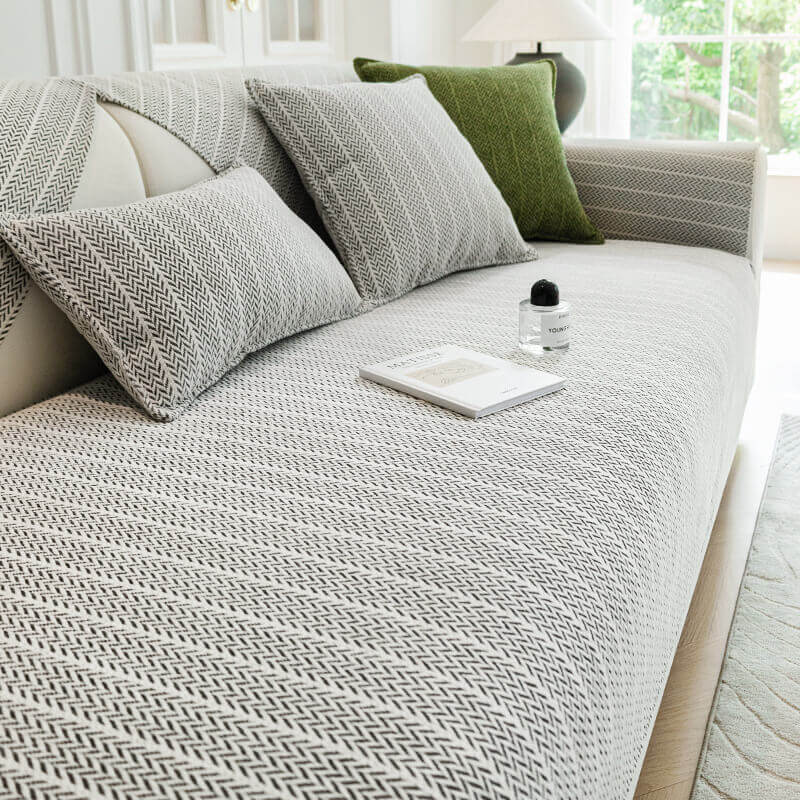 Chenille couch cover on a sofa, protecting it from pet scratches