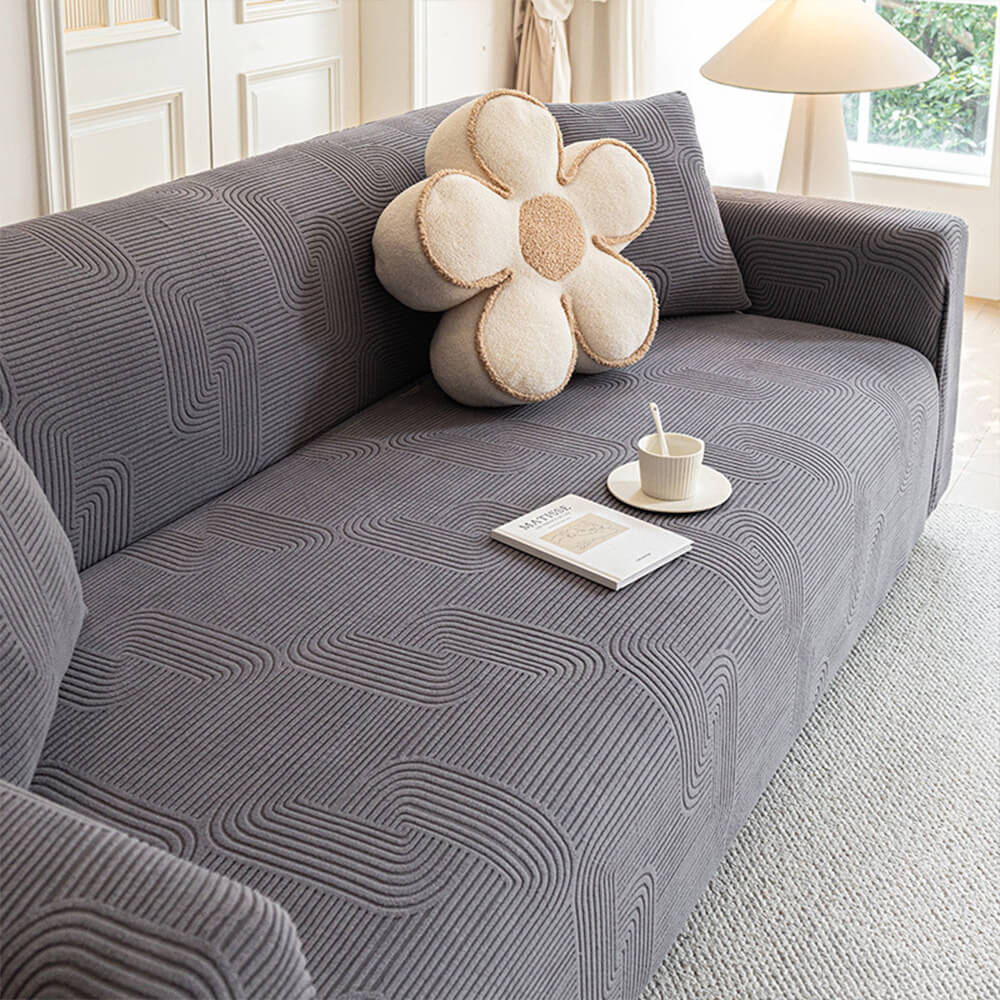All-Weather Fleece Sofa Cover in living room setting, showcasing its plush texture and fit.