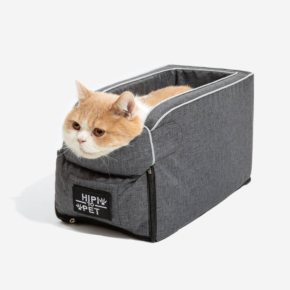 Suede pet console seat installed in a car, showing a small dog relaxing inside